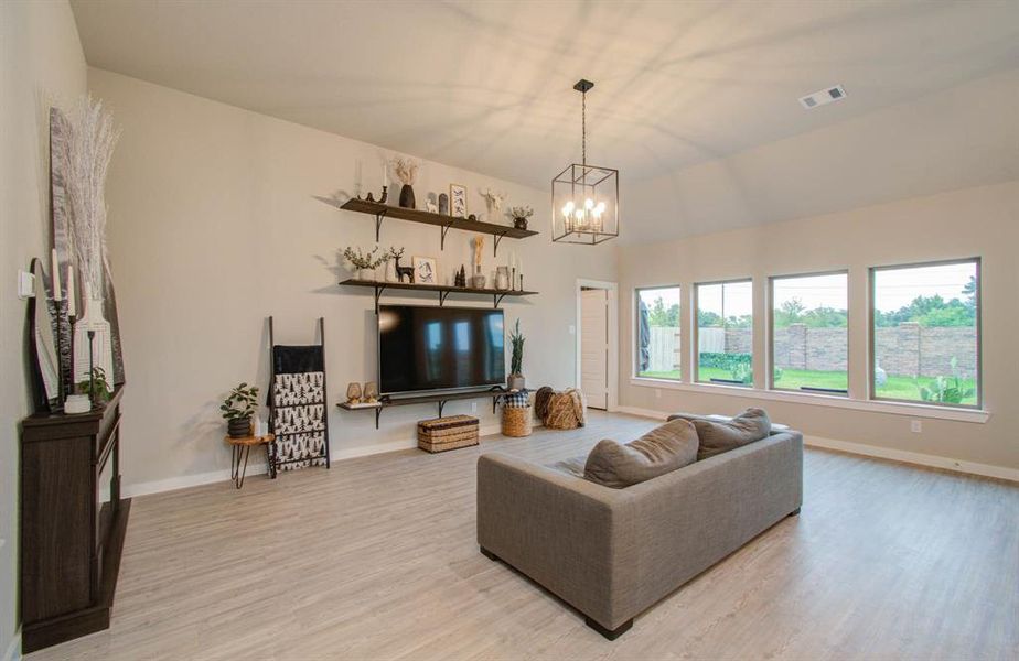 Family Room with wall of windows and views of the backyard.