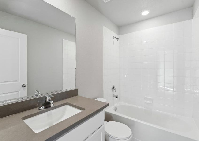 The secondary bathroom has a tub/shower combo.