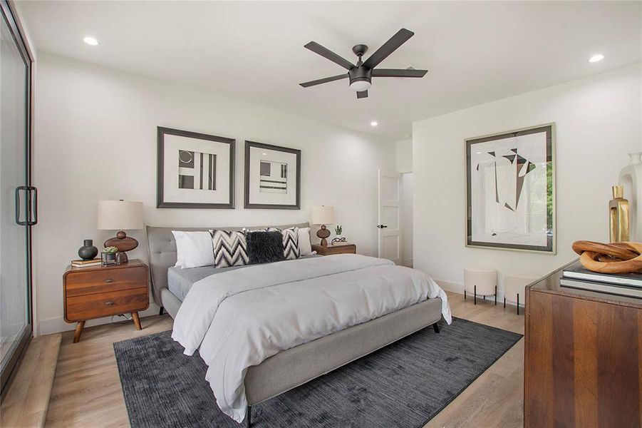 Bedroom with light wood-type flooring and ceiling fan