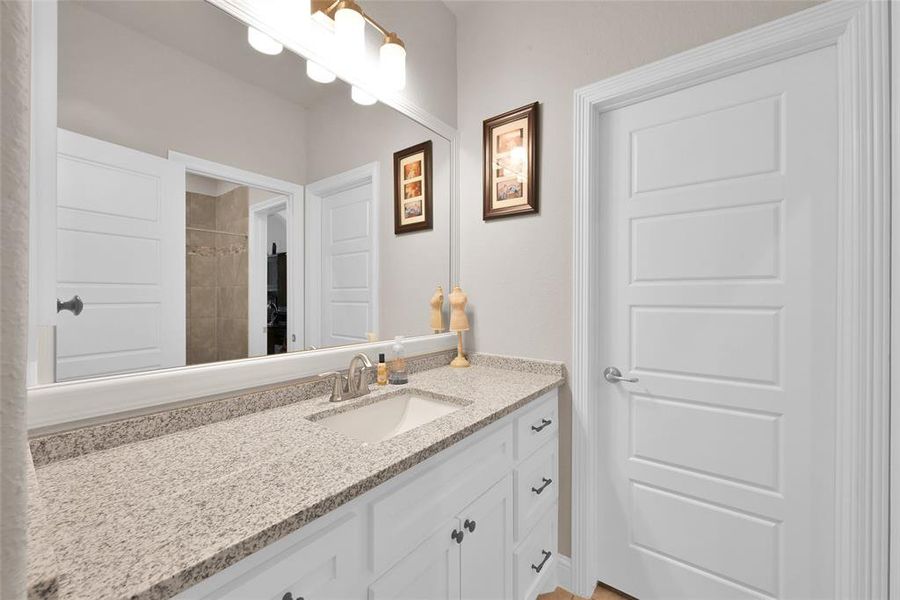 Secondary bedroom access to private vanity area and walk-in closet!