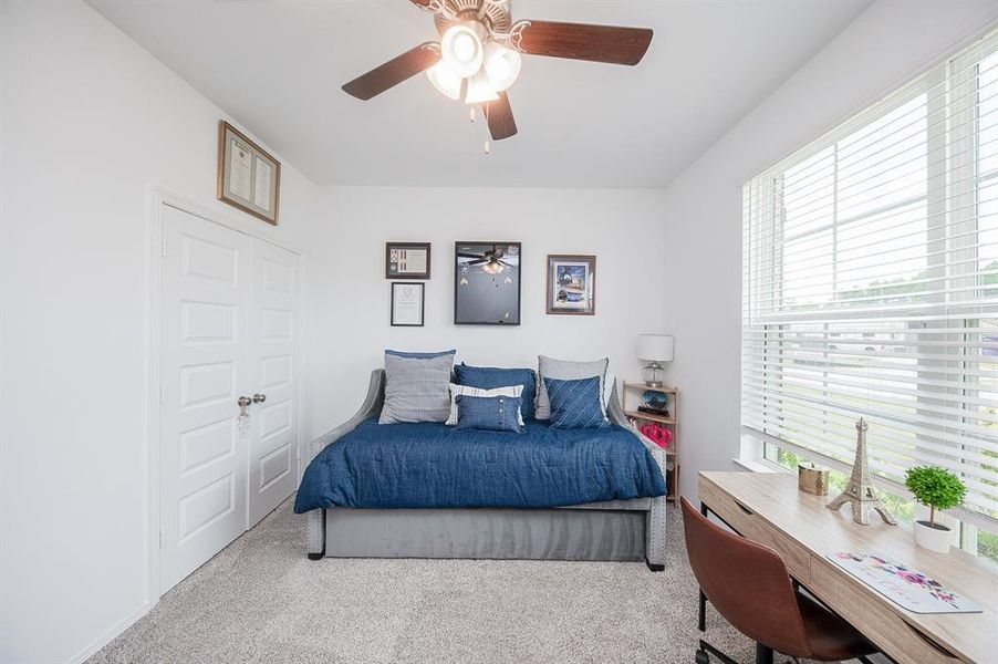 This is the bedroom which faces the front yard.  It is large & has a ceiling fan and great closet.