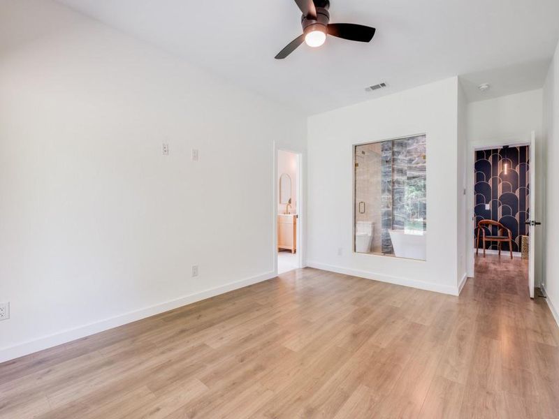 Spare room with light hardwood / wood-style floors and ceiling fan