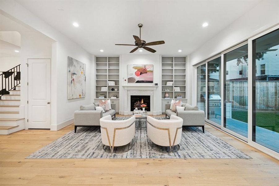 Family Room with 42” Direct Vent Fireplace, 2 x 5 Picket Mosaic Tile Surround completed in a Vertical Design and a Wood Mantle. There is a Conduit above the Fireplace for a TV and a Minka-Air Burnished Wood Ceiling Fan. This Room is also Pre-Wired for Home Theatre (5 Speaker Locations and 1 Sub-Woofer).