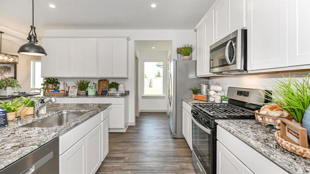 Now this is what I call a Gourmet Kitchen! Gourmet Kitchen will have Beautiful Tall Shaker Cabinets that will surround you! Walk in pantry for all your storage needs! **Image Representative of Plan Only and May Vary as Built**