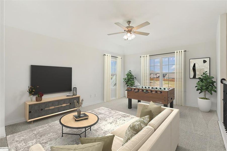 Carpeted living room featuring ceiling fan