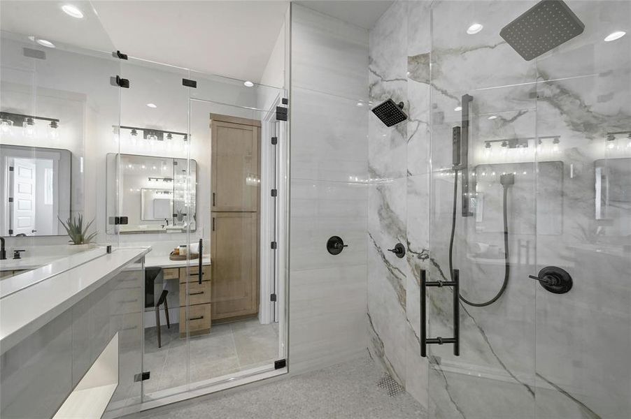 Spa inspired designed shower enclosure featuring dual shower heads, body spray, and overhead rain shower. Truly a luxury designed space built for the ultimate in relaxation.