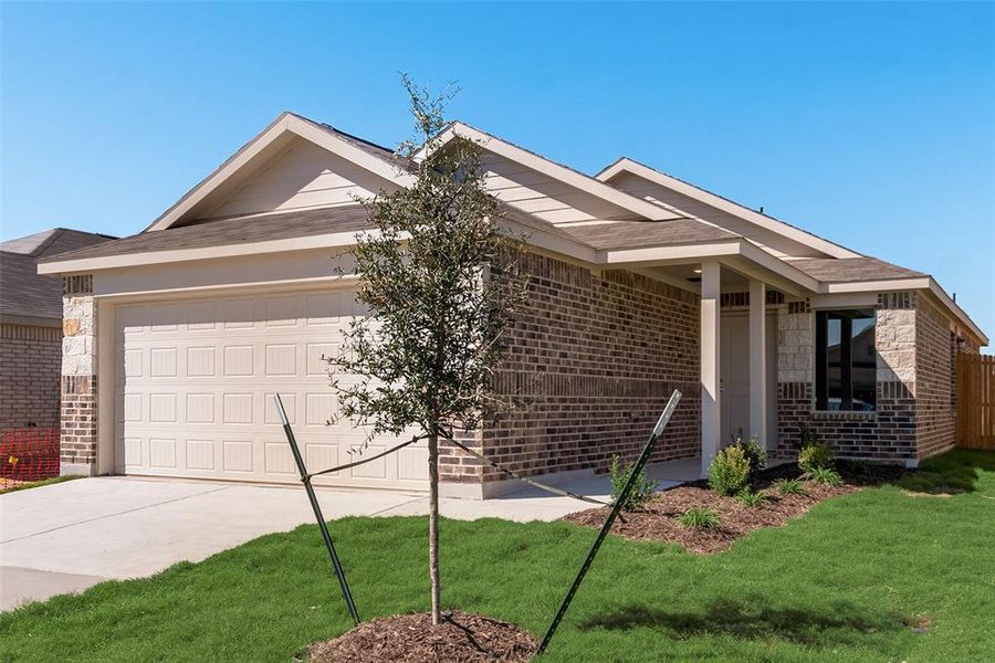 Ranch-style home with a garage and a front lawn