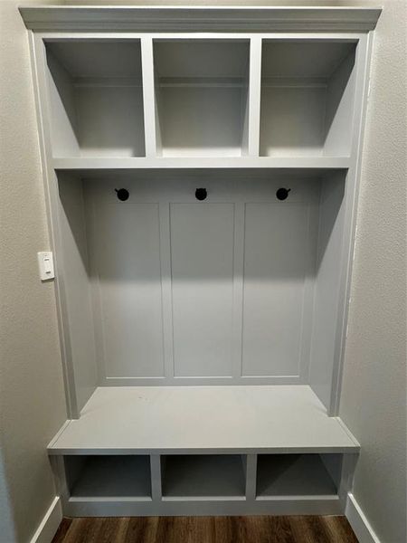 Mudroom featuring dark wood-type flooring