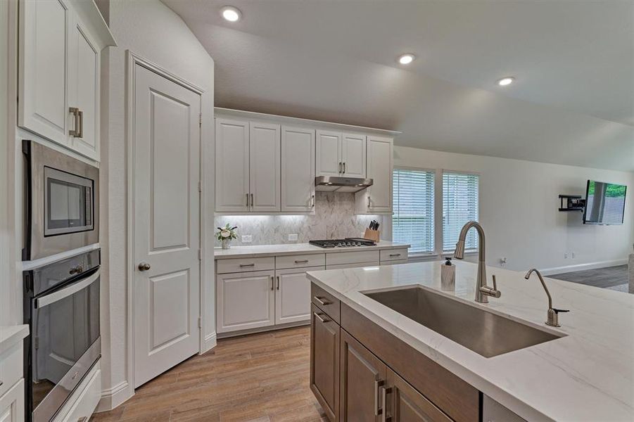 Gas cooktop, SS appliances and 42” cabinets all make this kitchen very desirable