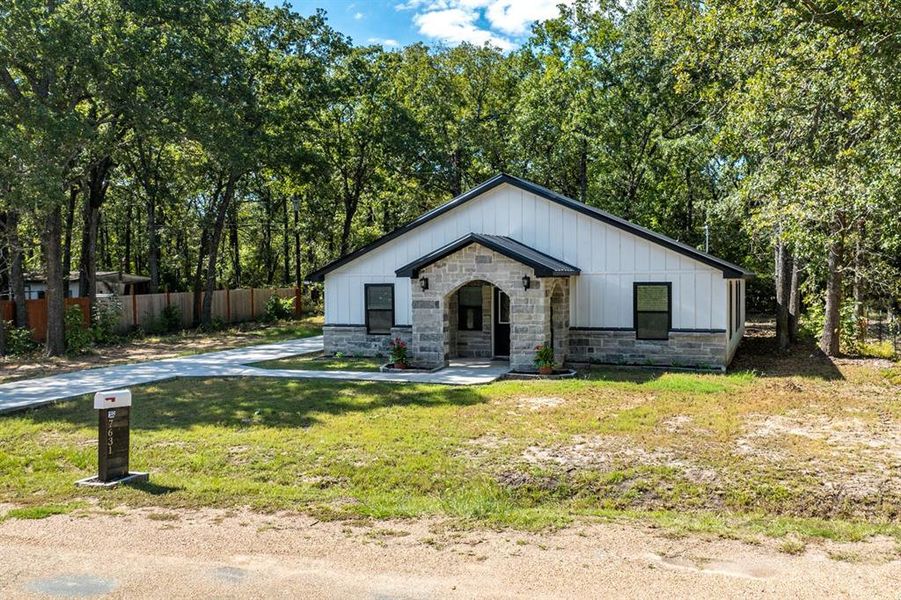 View of front of home featuring a front lawn