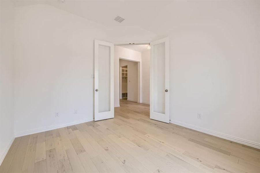 Empty room featuring light wood-type flooring