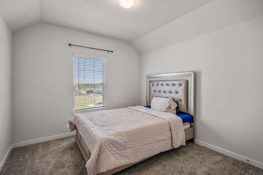 The final of the secondary bedrooms with accent paint, plush neutral carpet, , natural light, and spacious closet. *This photo has been virtually staged
