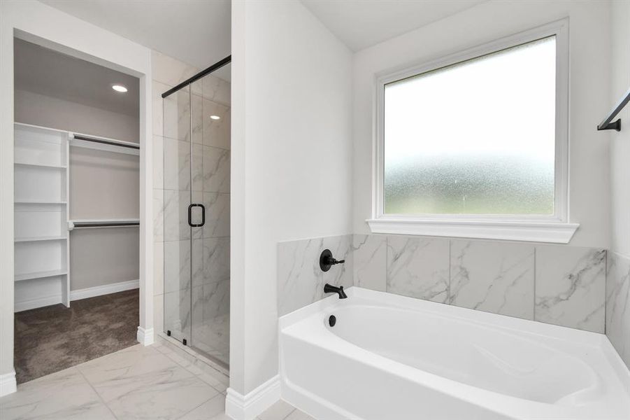 Primary Bath, with glass door shower and comfortable tub