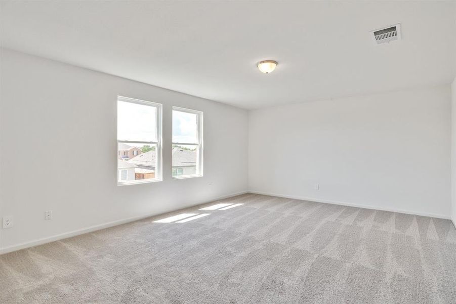 Spare room with light carpet