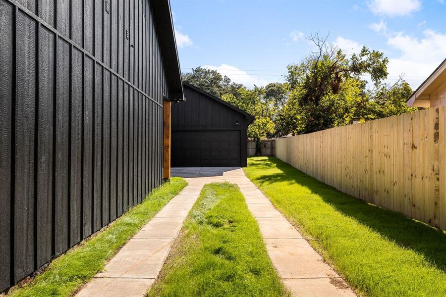 View of yard with a garage