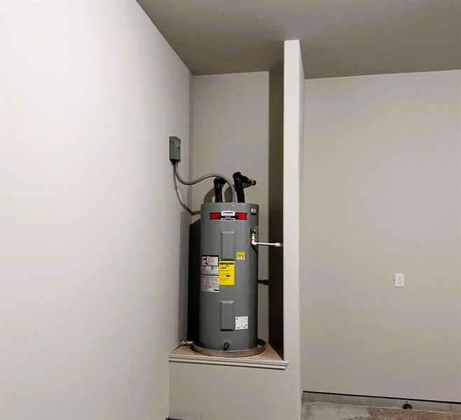 Hot water heater in the garage for easy access.