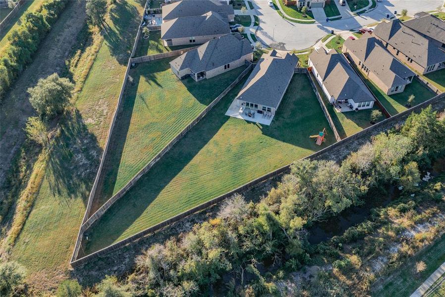 this aerial is looking from the back of the lot towards your new home