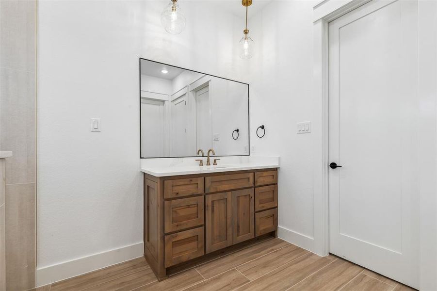 Bathroom featuring hardwood / wood-style floors and vanity