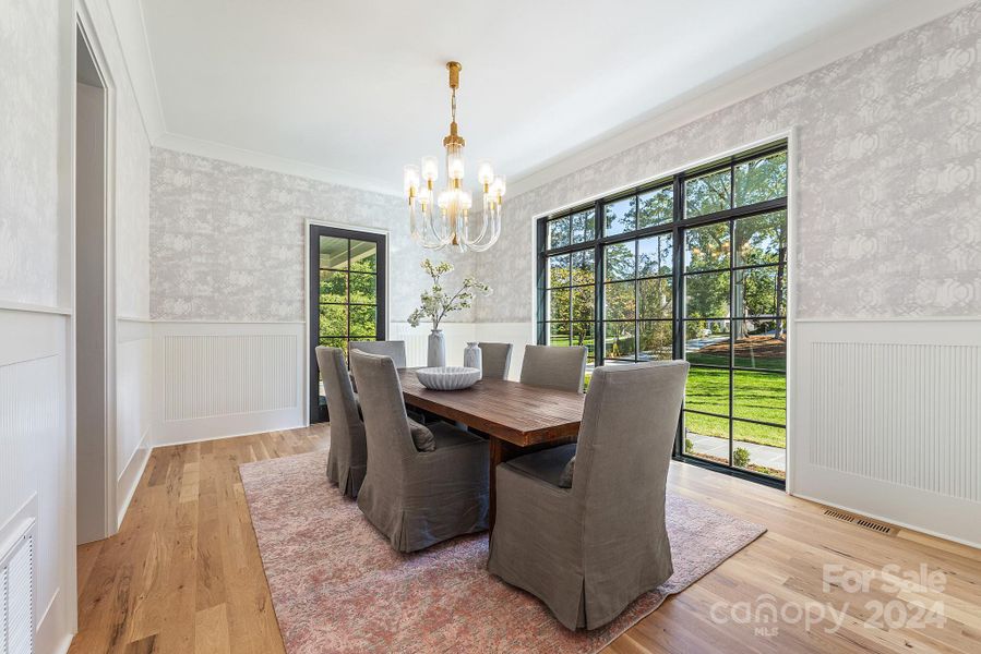 Light filled dining room with access to cocktail porch.