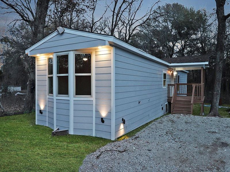 View of outbuilding featuring a yard