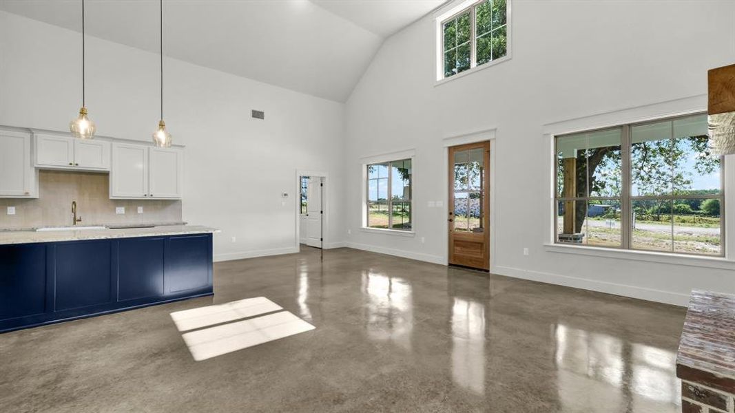 Vaulted ceilings with large windows for all that natural light to shine through your new home!