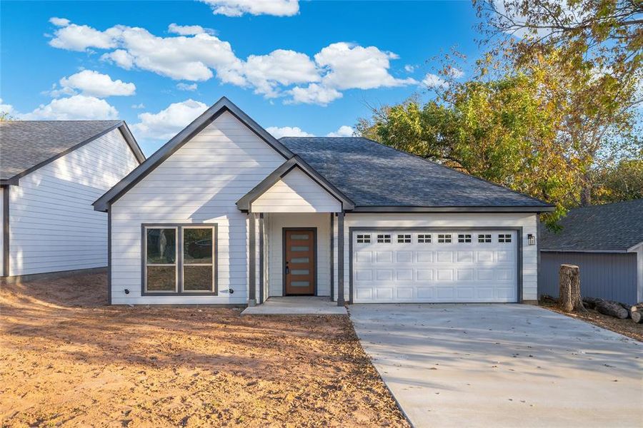 View of front of property with a garage