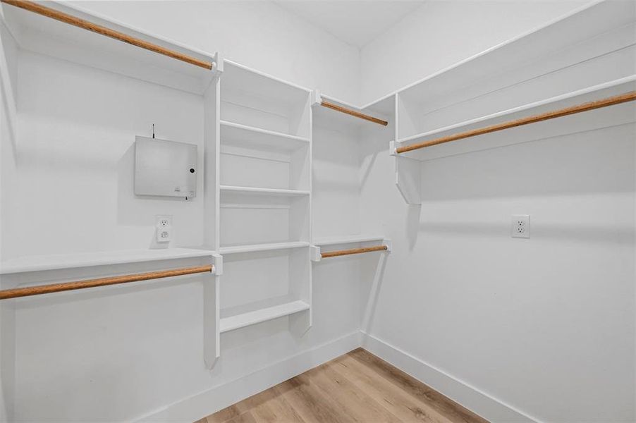 PRIMARY WALK-IN CLOSET.