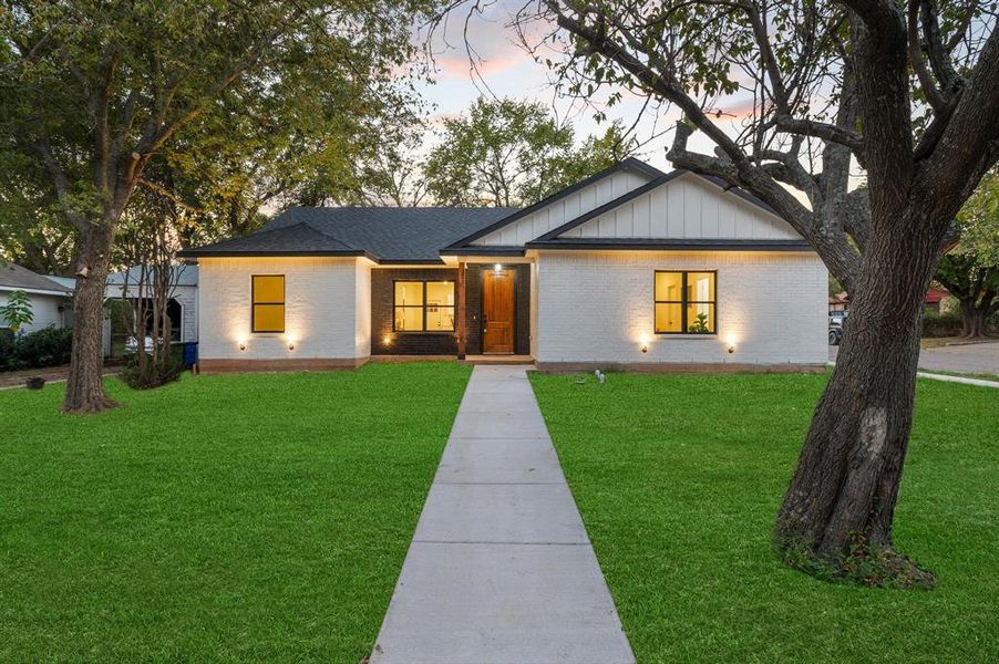 View of front of home featuring a lawn