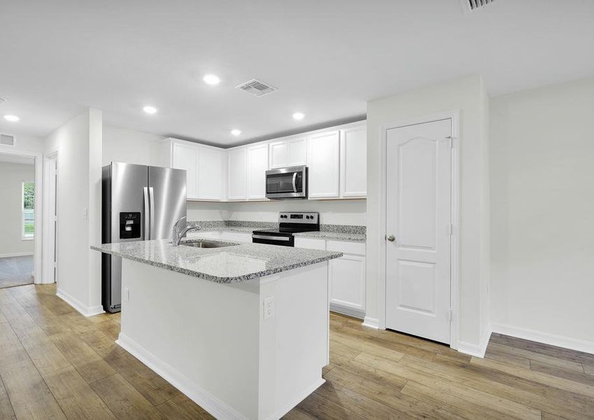 The kitchen of the Brickell has a large island, perfect for hosting