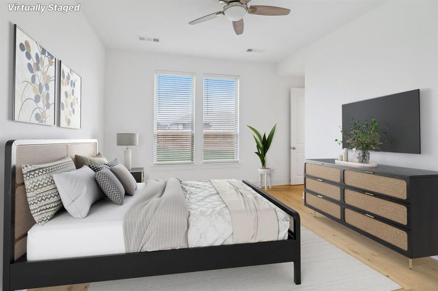 Bedroom featuring ceiling fan and light hardwood / wood-style floors