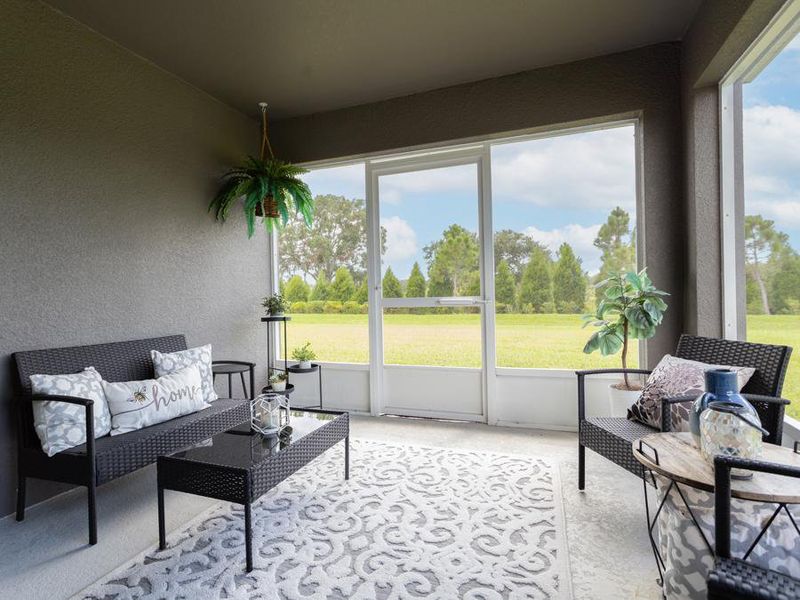 Take in the fresh Florida air on your covered lanai - Paisley by Highland Homes