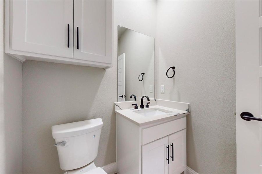 Bathroom with vanity and toilet