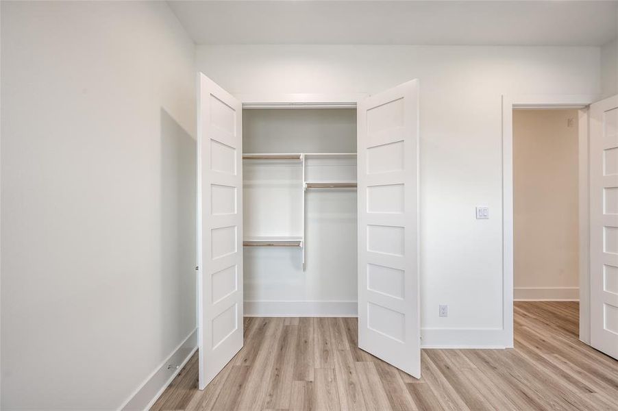 There is a large double door closet in the secondary bedroom.