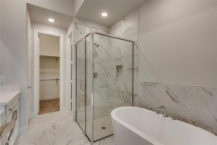 Bathroom with vanity, tile patterned floors, and separate shower and tub