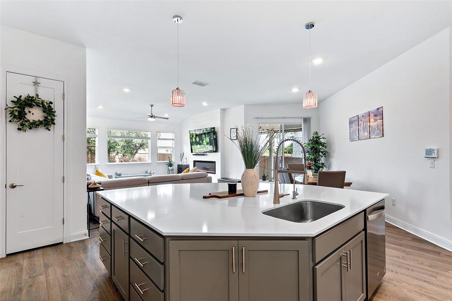 The kitchen is also open to the family room and comes with upgraded decorator pendant lights.