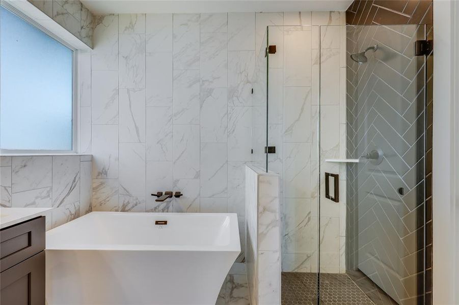 A highlight of the day! Soaking in an oversized tub with floor to ceiling tile