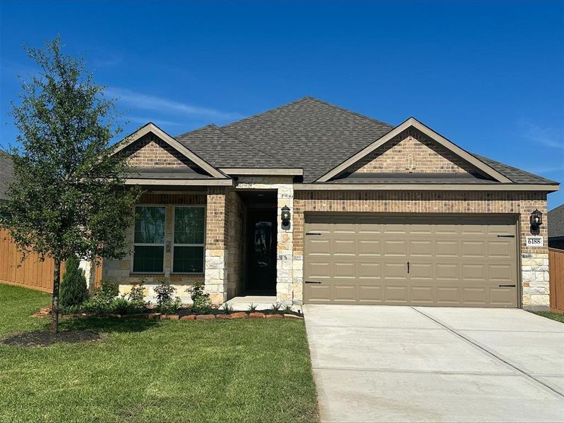 The Alder is a beautiful floorplan with a unique design combination of stone and brick.