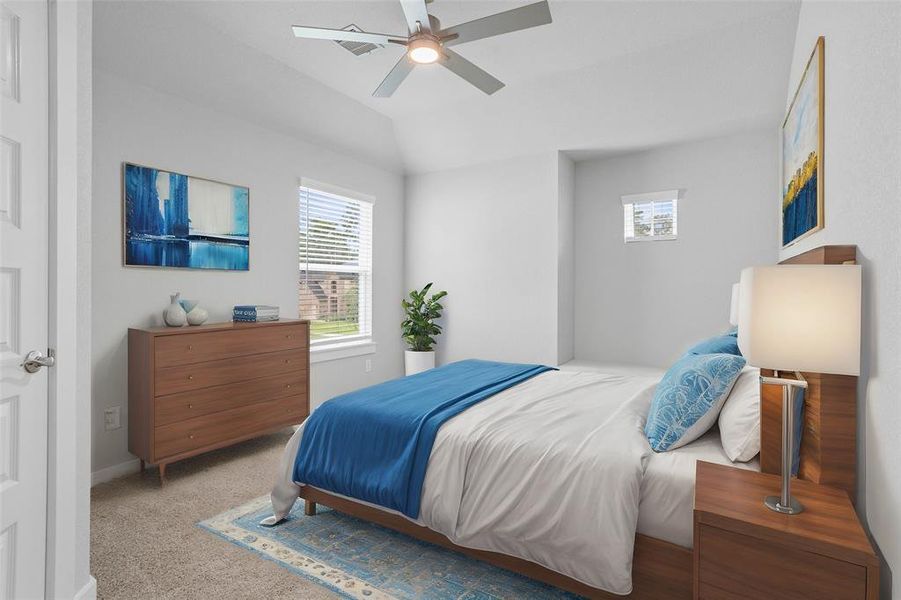 Secondary bedroom features plush carpet, custom paint, ceiling fan, large window with privacy blinds, and private access to a secondary bathroom vanity, and jack and jill shared shower/tub combo, and toilet.