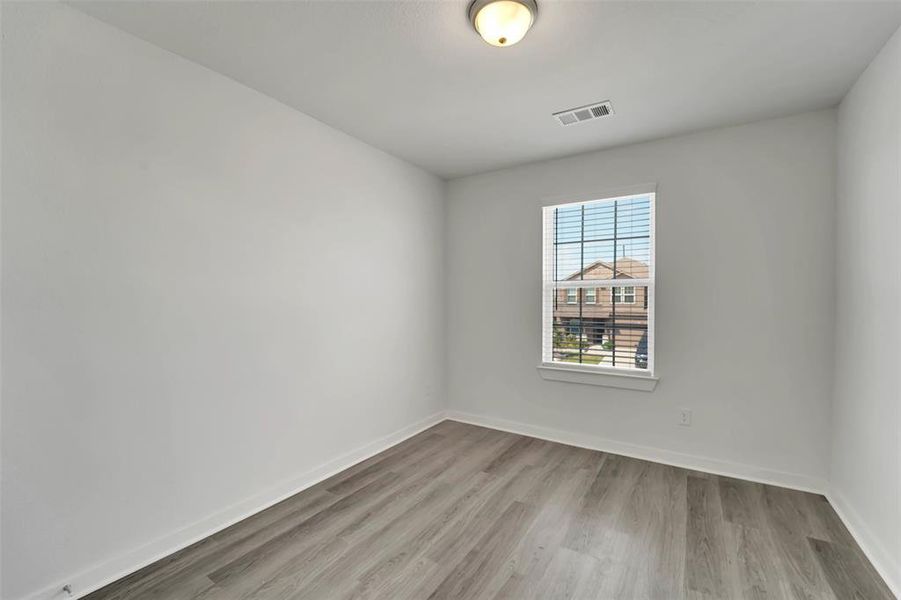 Spare room featuring light hardwood / wood-style floors