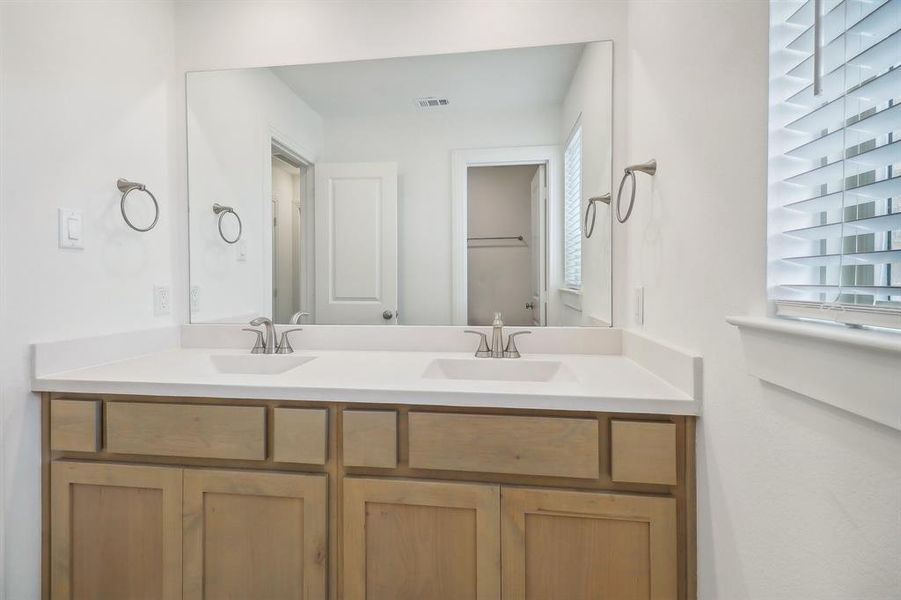 3rd Bathroom featuring dual vanity