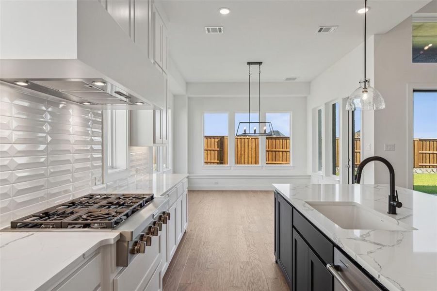 Gorgeous finishes combined with tons of storage make this a kitchen the entire family will love.