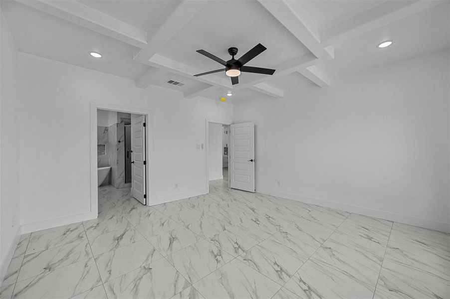 Tiled spare room with beamed ceiling, coffered ceiling, and ceiling fan