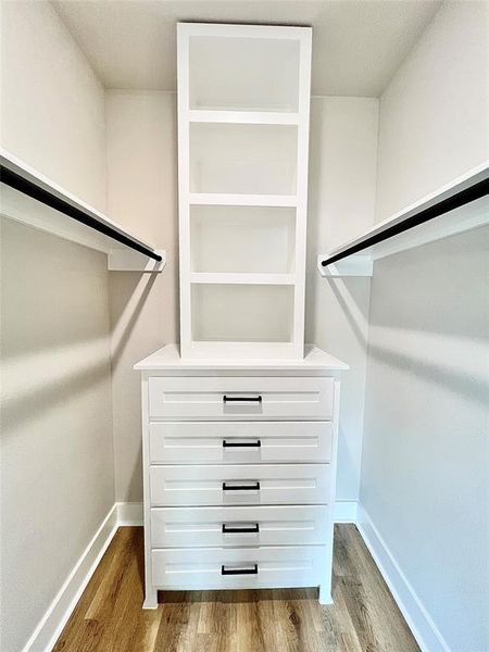 Third bedroom closet with built in closet cabinetry