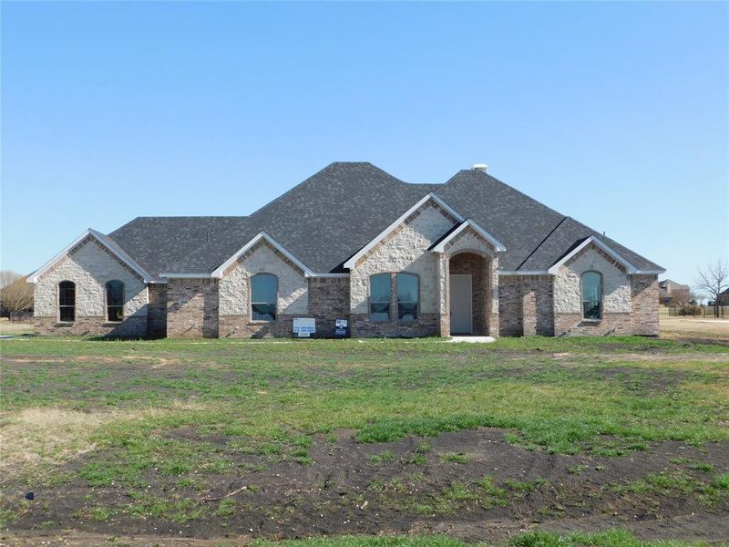 French country style house with a front lawn