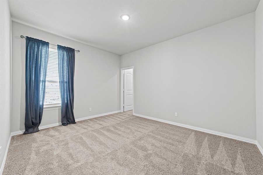 View of carpeted spare room