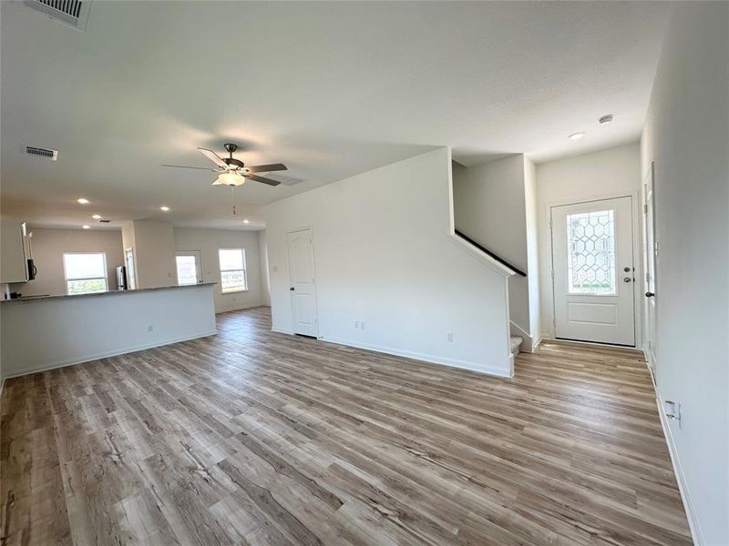 Luxury vinyl plank flooring throughout Family, Dining and Kitchen.