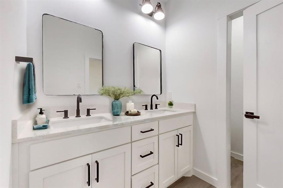 Bathroom with vanity and wood-type flooring