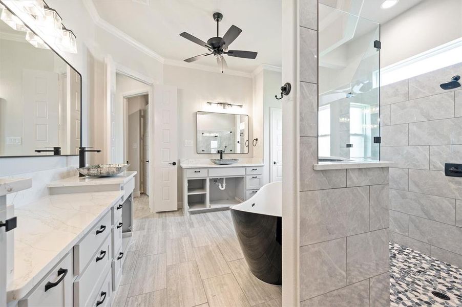 Bathroom featuring vanity, ceiling fan, tile patterned flooring, and crown molding