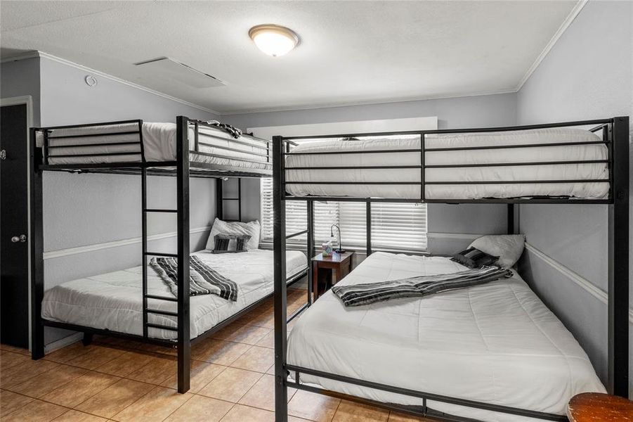 Bedroom 2 on main floor with 2 queen bunk beds