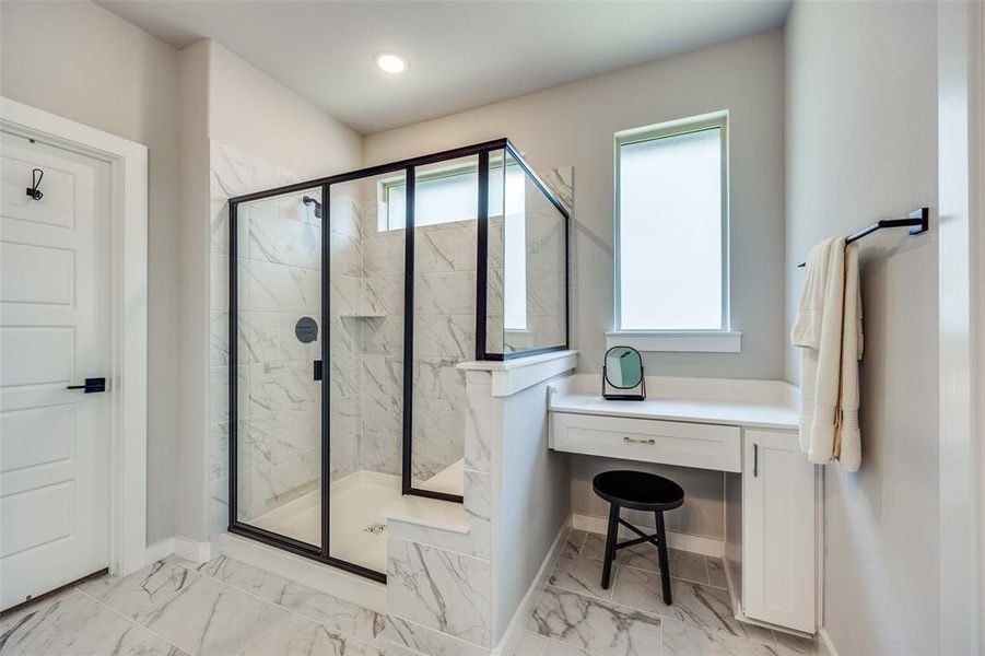 Primary Bathroom featuring vanity and a walk-in shower